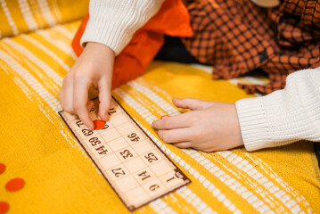 Happy father and child playing board game at home - happiness and family concept.