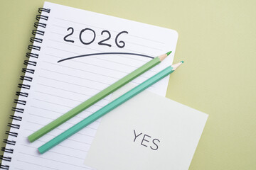  Planning for 2026 with an affirmative 'Yes' and green pencils. New Year's commitment