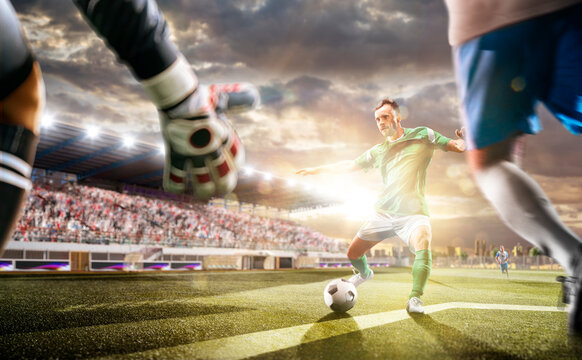 Soccer players in action on the sunset stadium background. Panorama. Sports concept. Football players. The decisive match. Soccer championship.