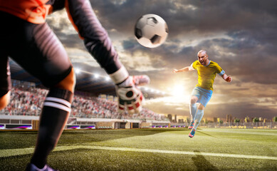 Fototapeta premium Soccer players in action on the sunset stadium background. Panorama. Sports concept. Football players. The decisive match. Soccer championship.