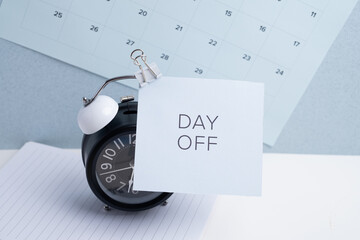 Day off - workplace message in the office. Concept of absence from work and day off