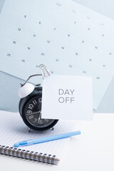 Day off - workplace message in the office. Concept of absence from work and day off