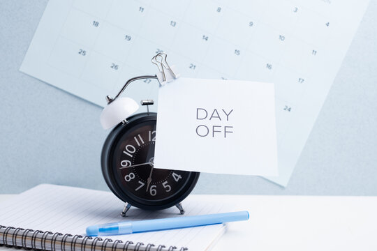 Day off - workplace message in the office. Concept of absence from work and day off