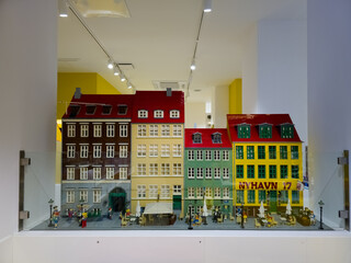 Naklejka premium Copenhagen, Denmark - November 3, 2025: Model of the New Harbour Nyhavn at the showroom of the Lego store