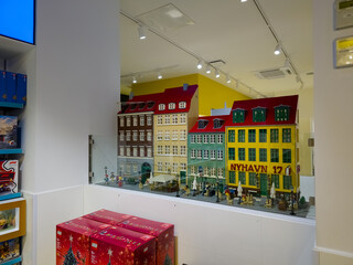 Naklejka premium Copenhagen, Denmark - November 3, 2025: Model of the New Harbour Nyhavn at the showroom of the Lego store