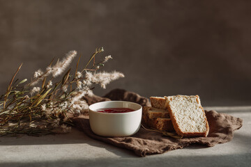 delightful jar of homemade jam placed on brown craft paper napkin creates charming breakfast setting