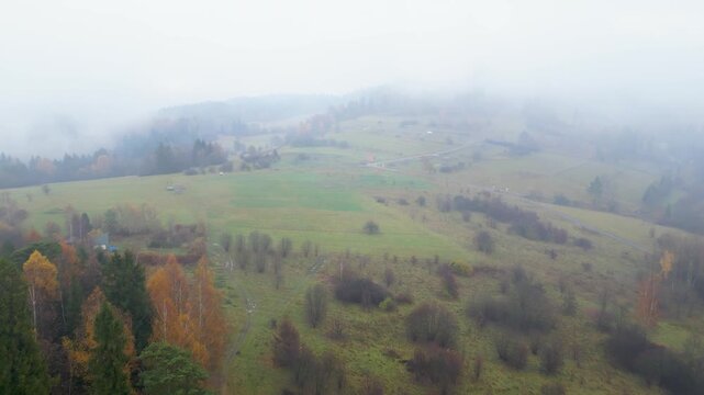 Mountain Meadows and Road Covered by Dense Fog on a Cold Autumn Morning. Rabka-Zdr&oacute;j, Poland