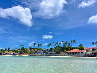 Many resorts and hotels at the shore of a white sand tropical beach in Chaweng, Koh Samui Island, Thailand