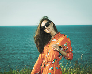 Young retro woman by the sea