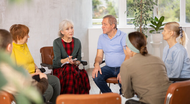 Senior woman doing group therapy for adult seniors