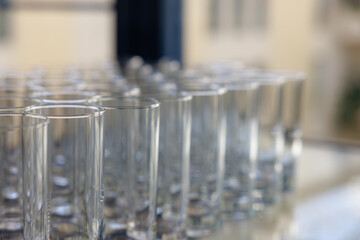 Sparkling glassware arranged neatly in a bright venue ready for a special gathering