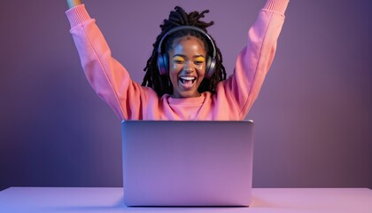Excited african woman rejoices over laptop win. Gamer celebrates victory in cyberspace with headphones. Enjoys entertainment, playing on computer, expressing joy. Modern tech allows leisure activity