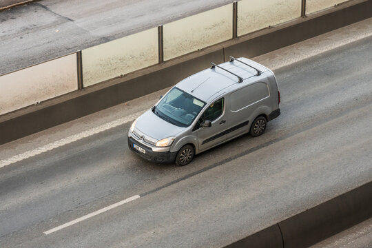 Gothenburg, Sweden - February 16 2025: aerial view of silver citro?n van driving on urban road.
