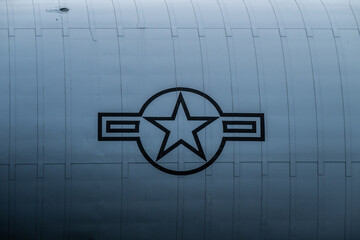Naklejka premium Sola, Norway - June 16 2024: US Air Force insignia on a grey military transport air plane.
