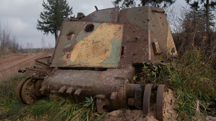 photographer captures haunting scene of neglected armored hull amid wilderness and industrial ruin