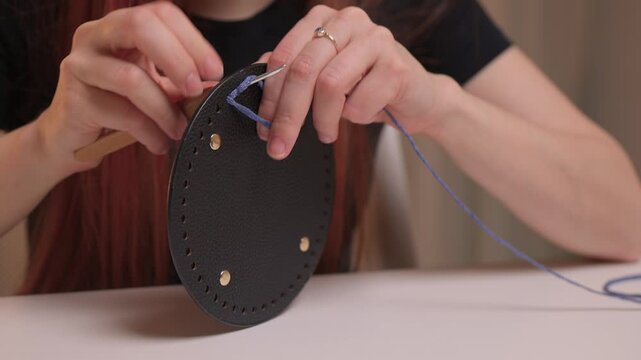 Crochet workshop scene, Artisan at work with yarn, Cozy crafting space with textured handmade stitches, Quiet studio environment dedicated to knitting and crochet crafts today