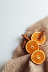 delightful still life composition featuring burlap fabric fragrant cinnamon sticks and fresh orange slices