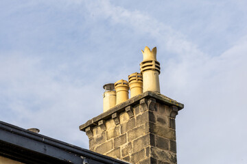 Chimney with four pots against sky
