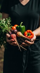 Person Holding Freshly Harvested Vegetables from Garden.
