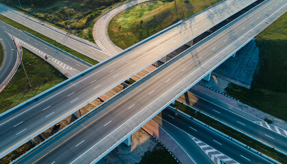 Aerial view of a complex highway interchange with multiple overpasses and ramps, showcasing modern infrastructure and traffic flow