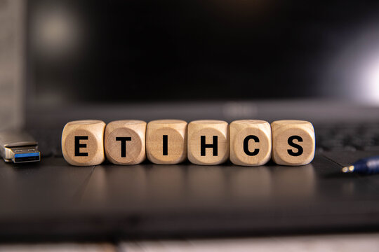 The word ETHICS made of small colorful cubes and many scrambled letters