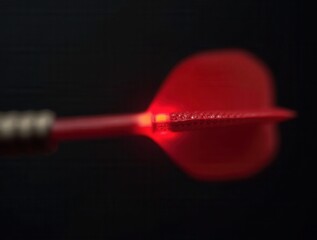 Glowing red dart aiming for success