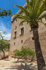 Exterior view of Castelldefels Castle, a 10th-century fortress on a sunny summer day