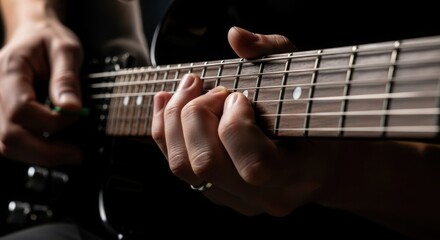Electric guitar close up as person plays guitar, strings vibrating with musical energy. Guitar player is engrossed, fingers dancing over frets to make chords and melodies,