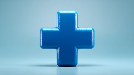 Obraz premium Shiny blue medical cross symbol on a soft blue background, conveying a sense of health and care.