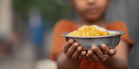 Offering Bowl of Rice on World Food Day, Small Boy Shares Simple Meal With Hopeful Expression