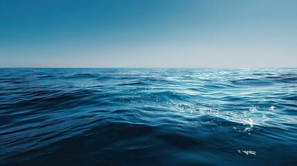 Obraz premium Sunlit Ocean Surface With Sparkling Reflections Under Blue Sky Horizon