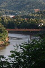 Fototapeta premium Old steel bridge in Luang Prabang and Nam Khan River
