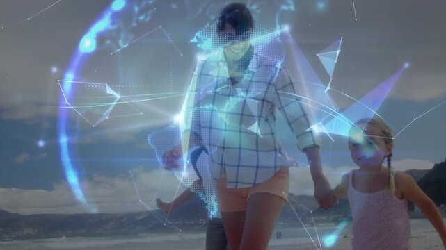 Mom holding girl's hand dad carrying son walking beach camera moving AR globe forming over group