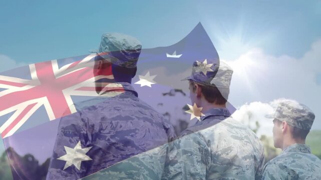 Military trio standing field, AU flag overlay rippling, sun glowing causing center trooper pointing
