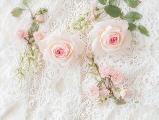 Elegant floral arrangement featuring soft pink roses on delicate lace
