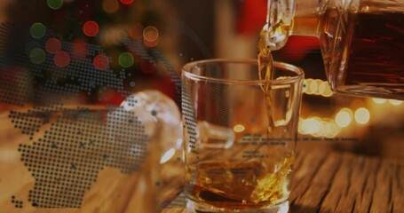 Decanter tilting pouring, tumbler filling with amber liquid swirling settling showing dotted globe - Powered by Adobe