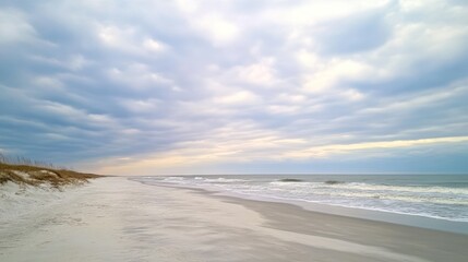 serene beach vista under a cloudy sky, sandy shore meeting the gentle ocean waves, calm seascape offering a tranquil and peaceful mood