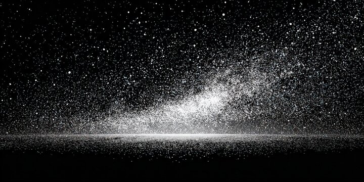 Abstract Scene of Bright Speckled Particles Floating Against Dark Background with Focused Light and Reflective Surface