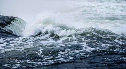 Naklejka premium A dynamic seascape showcasing the raw power of nature, with turbulent waves crashing and frothing, creating a visual symphony of motion and energy in a monochromatic palette, and a sense of awe.