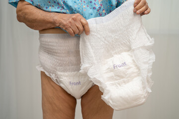 Asian senior woman patient wearing incontinence diaper.