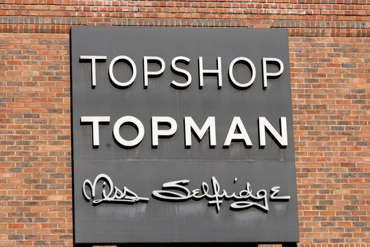 Sign with Topshop, Topman, and Miss Selfridge lettering in York, UK.