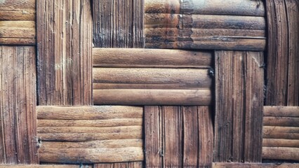 Traditional bamboo weave texture with geometric pattern and natural brown tones,