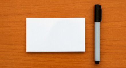 Top‑down of blank name tag with plain pen before writing