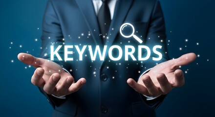 Businessman presents glowing keywords concept with a magnifying glass icon symbolizing search engine optimization and digital marketing strategies for online visibility and content discovery success