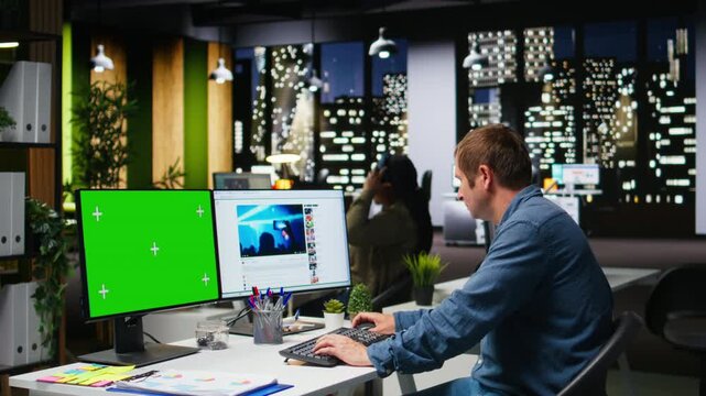 Green screen next to social media manager checks web platforms for content, boosting marketing and branding via current media trends and monetization insights. Algorithms. Camera A.