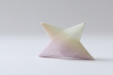 fantastical star made of colorful threads positioned against clean pastelcolored canvas