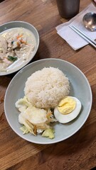 Utensils, Napkin, and Water Glass on Wooden Table