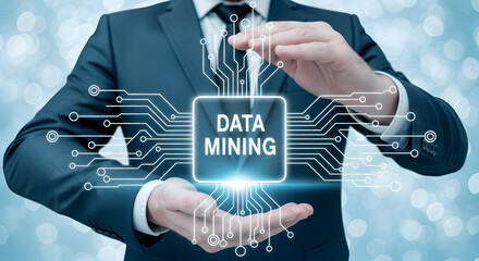 Businessman presents data mining concept with digital circuit board overlay showcasing technology analytics and business intelligence for strategic decisionmaking and innovation