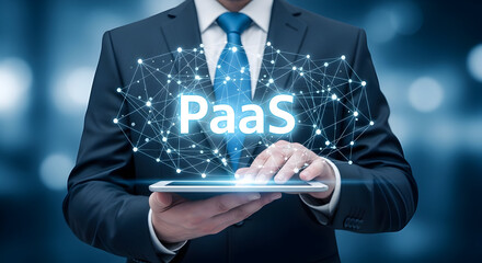 Businessman presents PaaS platform as a service on a tablet with a digital network overlay for cloud computing solutions and enterprise technology integration in a modern business environment