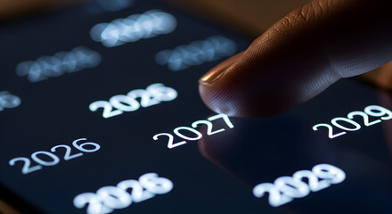 Fingers scrolling through years on a digital screen, focusing on 2027.